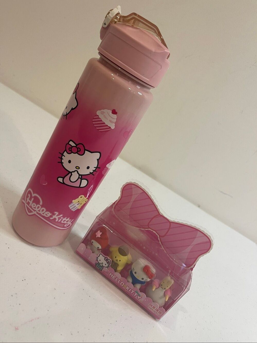 Hello Kitty water bottle and erasers